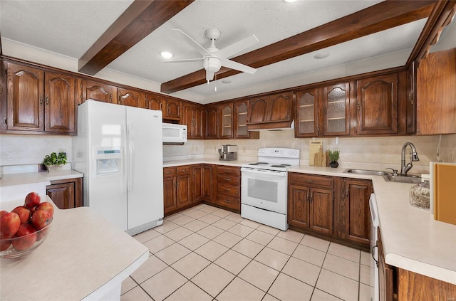 kitchen with sink, a textured ceiling, ceiling fan, beamed ceiling, and white appliances