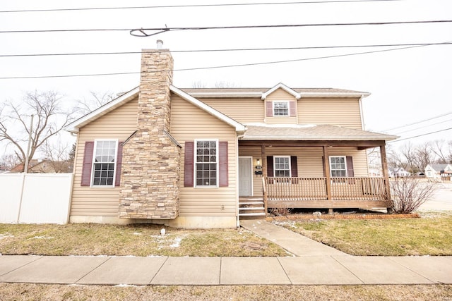 view of front of home featuring a front yard and a porch