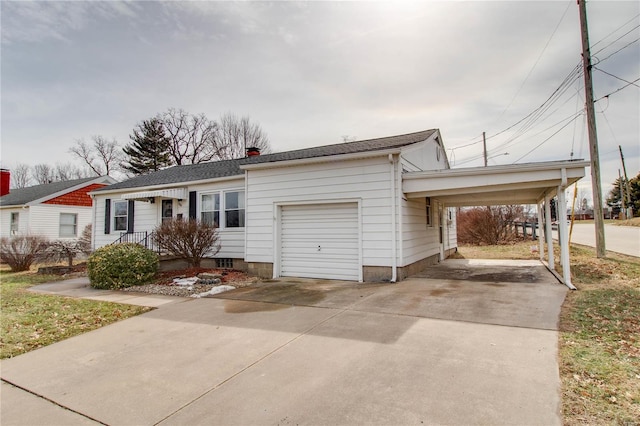 single story home with driveway, an attached garage, and an attached carport