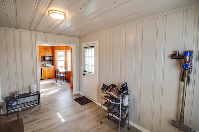 doorway to outside featuring wood finished floors