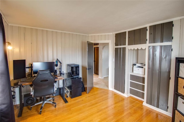 office space featuring ornamental molding and wood finished floors