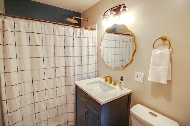 bathroom featuring a shower with curtain, vanity, and toilet