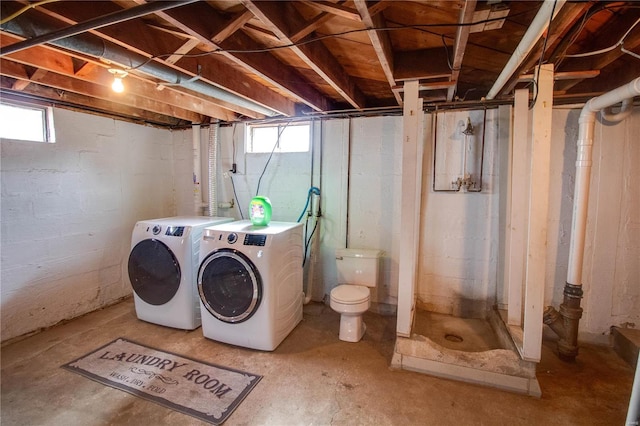 washroom featuring laundry area and washing machine and clothes dryer