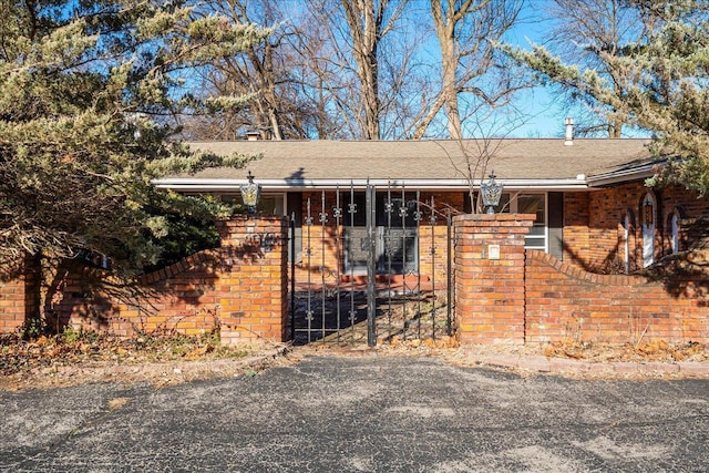 view of front of home featuring brick siding