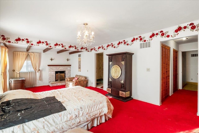 carpeted bedroom featuring a stone fireplace, visible vents, and an inviting chandelier