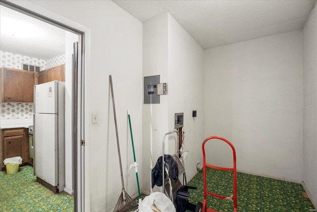 interior space with light floors, baseboards, visible vents, and a textured ceiling