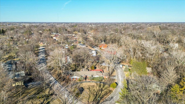 drone / aerial view featuring a forest view