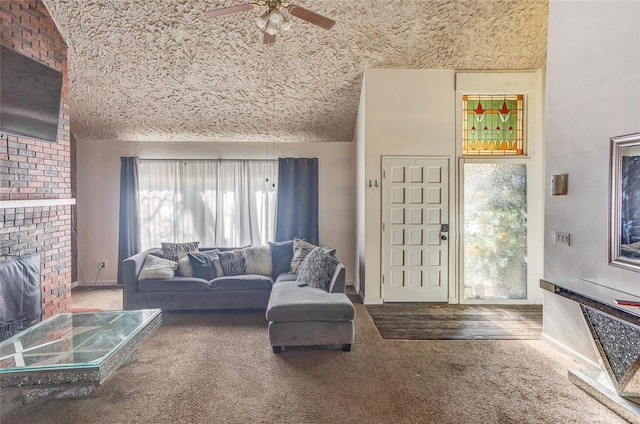 carpeted living room featuring ceiling fan, a fireplace, and a textured ceiling