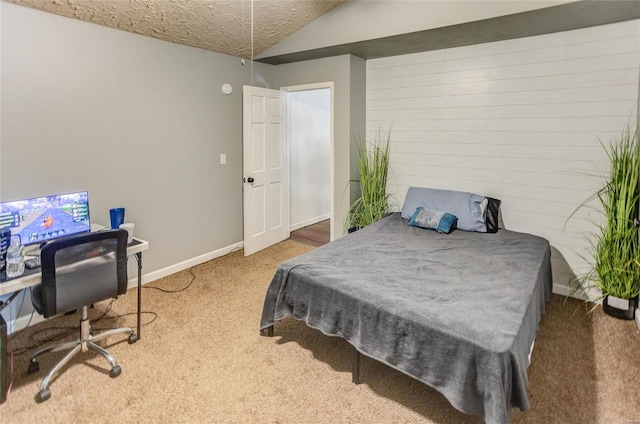 carpeted bedroom with vaulted ceiling and a textured ceiling