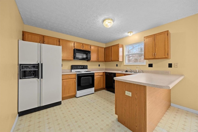 kitchen featuring kitchen peninsula, sink, a textured ceiling, and black appliances