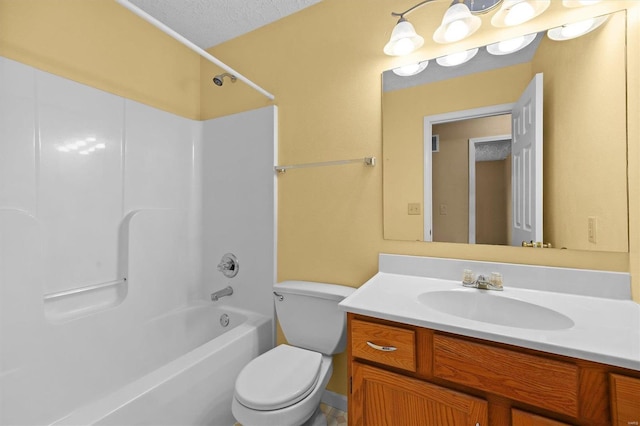 full bathroom featuring  shower combination, vanity, a textured ceiling, and toilet