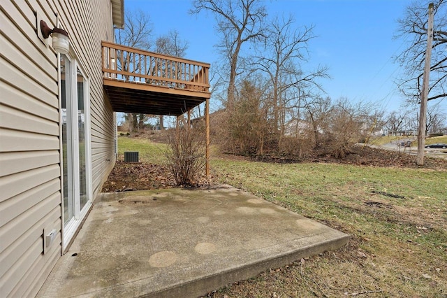 view of yard with a wooden deck and a patio