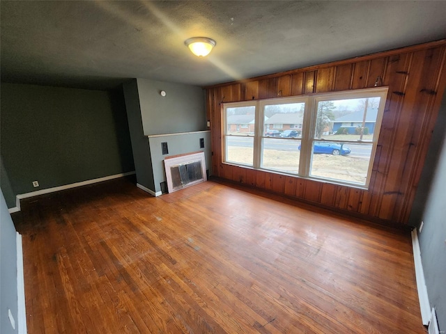 unfurnished living room with hardwood / wood-style floors