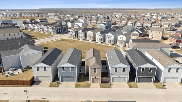 birds eye view of property with a residential view