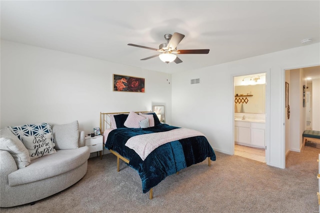 bedroom featuring visible vents, a ceiling fan, light carpet, connected bathroom, and baseboards