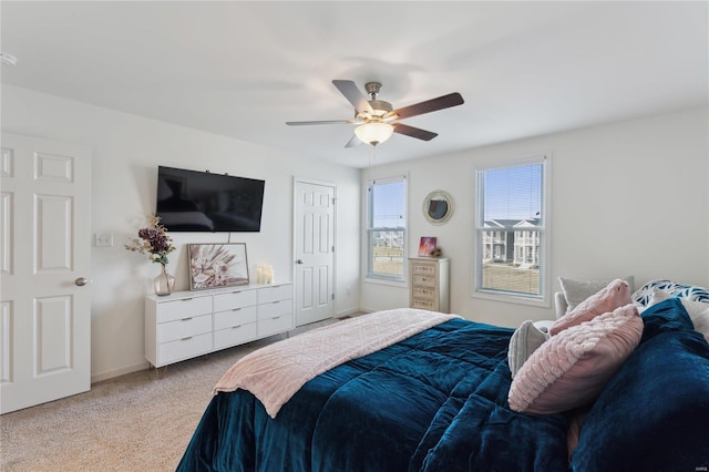 bedroom featuring carpet floors, ceiling fan, and baseboards