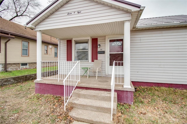 doorway to property with a porch