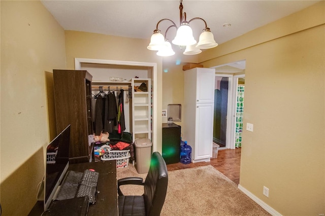 interior space with an inviting chandelier and a closet