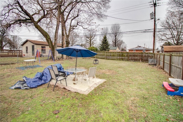 view of yard with a playground and a patio area