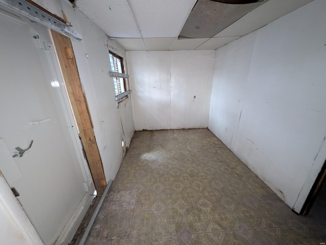 spare room featuring a paneled ceiling