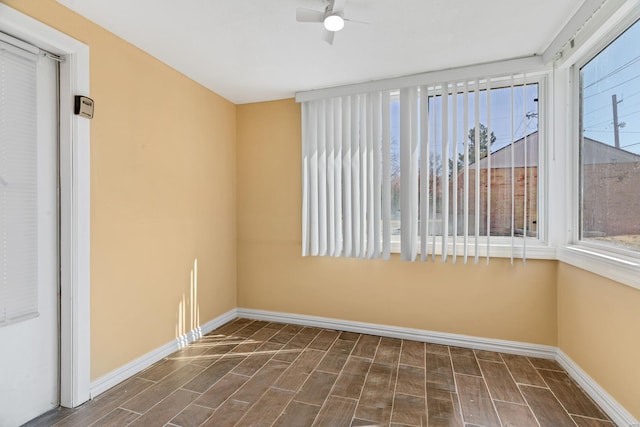 interior space featuring a ceiling fan and a wealth of natural light