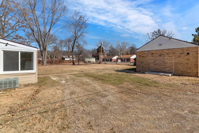 view of yard featuring central air condition unit