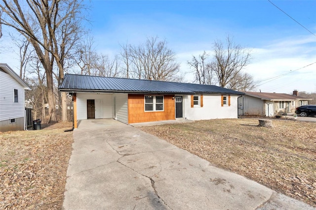 ranch-style home featuring a carport