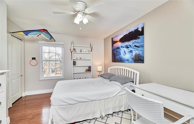 bedroom with wood-type flooring and ceiling fan