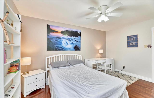 bedroom with dark wood-type flooring and ceiling fan