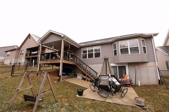 rear view of property with a yard and a patio area