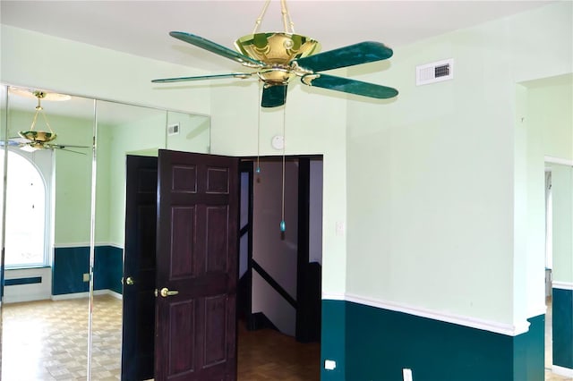 kitchen with ceiling fan and visible vents