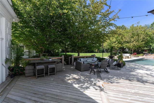 wooden deck with an outdoor living space