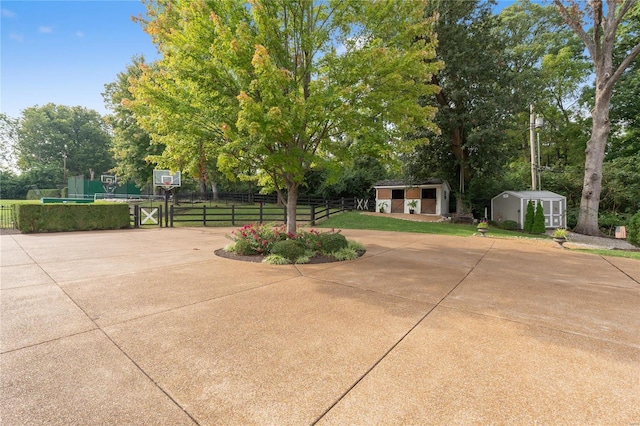 view of patio with a shed