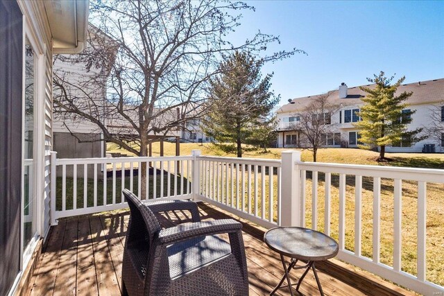 wooden deck with a residential view and a yard