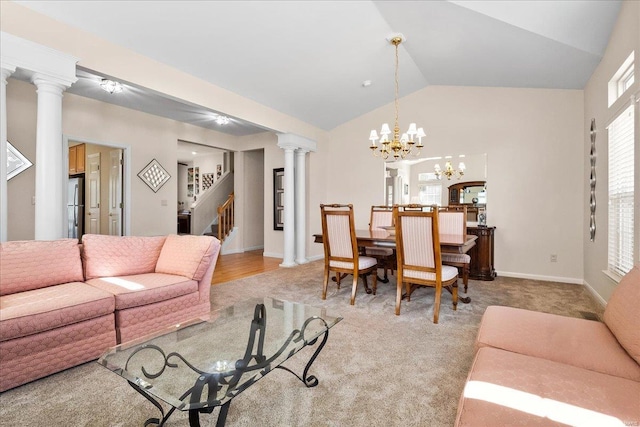 living room featuring ornate columns, stairway, light carpet, vaulted ceiling, and baseboards