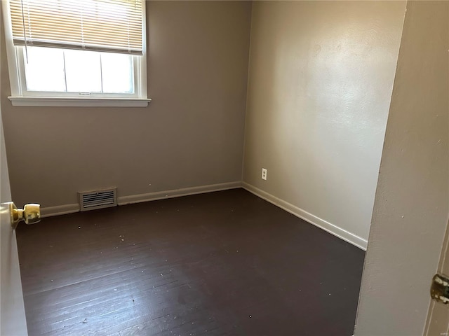 empty room with dark hardwood / wood-style floors