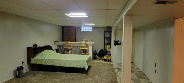 bedroom with bar and a drop ceiling