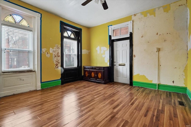 unfurnished room featuring hardwood / wood-style flooring and ceiling fan