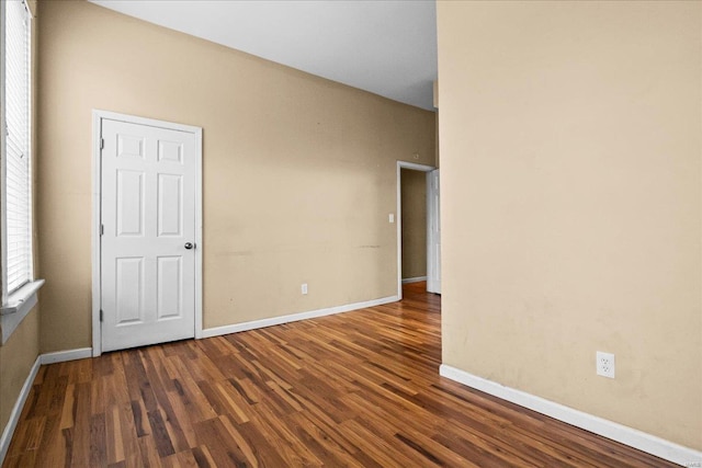 spare room featuring dark hardwood / wood-style floors