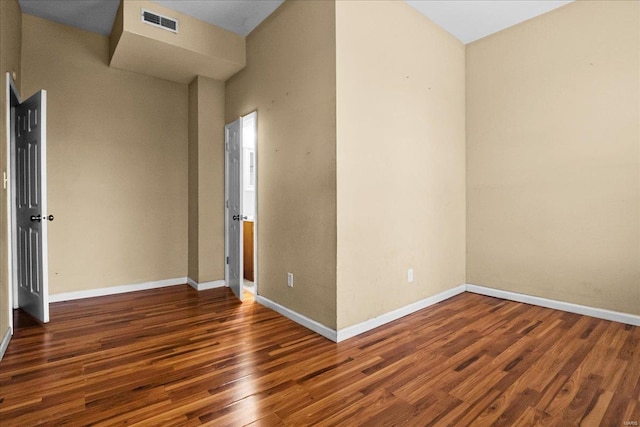 empty room featuring dark hardwood / wood-style floors