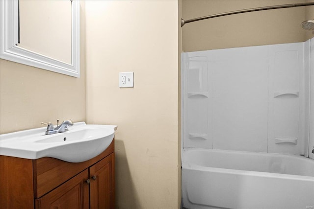 bathroom featuring shower / bath combination and vanity