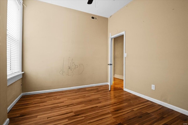 empty room featuring hardwood / wood-style flooring and ceiling fan