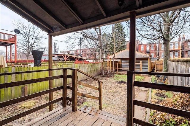 wooden terrace with a storage unit