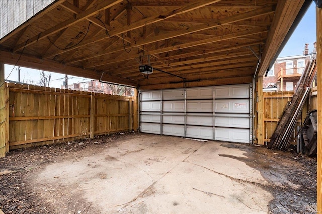 garage featuring a carport and a garage door opener