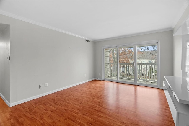 unfurnished room featuring crown molding and light hardwood / wood-style flooring