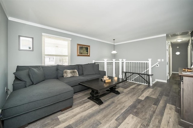 living room featuring ornamental molding and dark hardwood / wood-style flooring