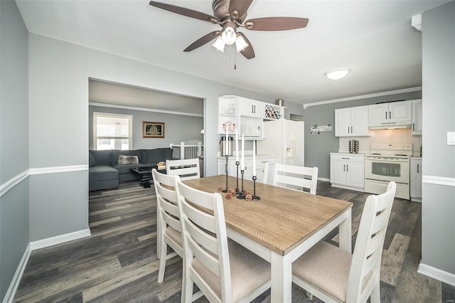 dining area with ornamental molding, ceiling fan, and dark hardwood / wood-style flooring