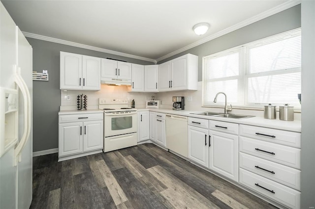 kitchen featuring sink, white cabinets, and white appliances