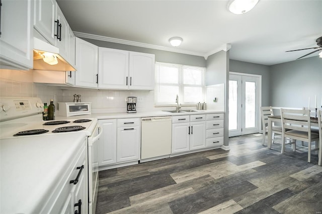 kitchen featuring white cabinetry, sink, white appliances, and backsplash