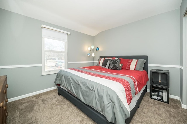 carpeted bedroom featuring vaulted ceiling